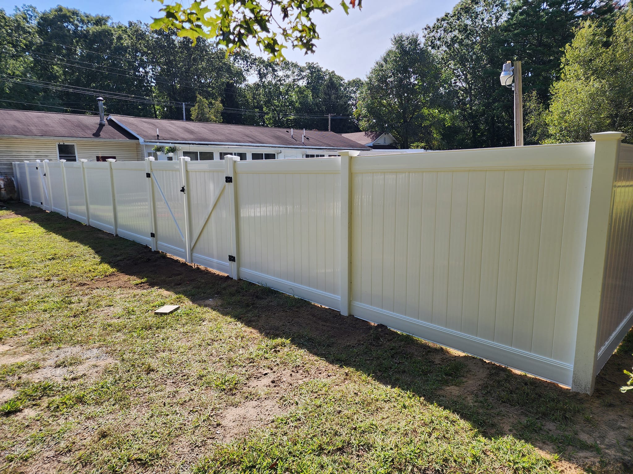 Vinyl fence install by Ocean County Exteriors